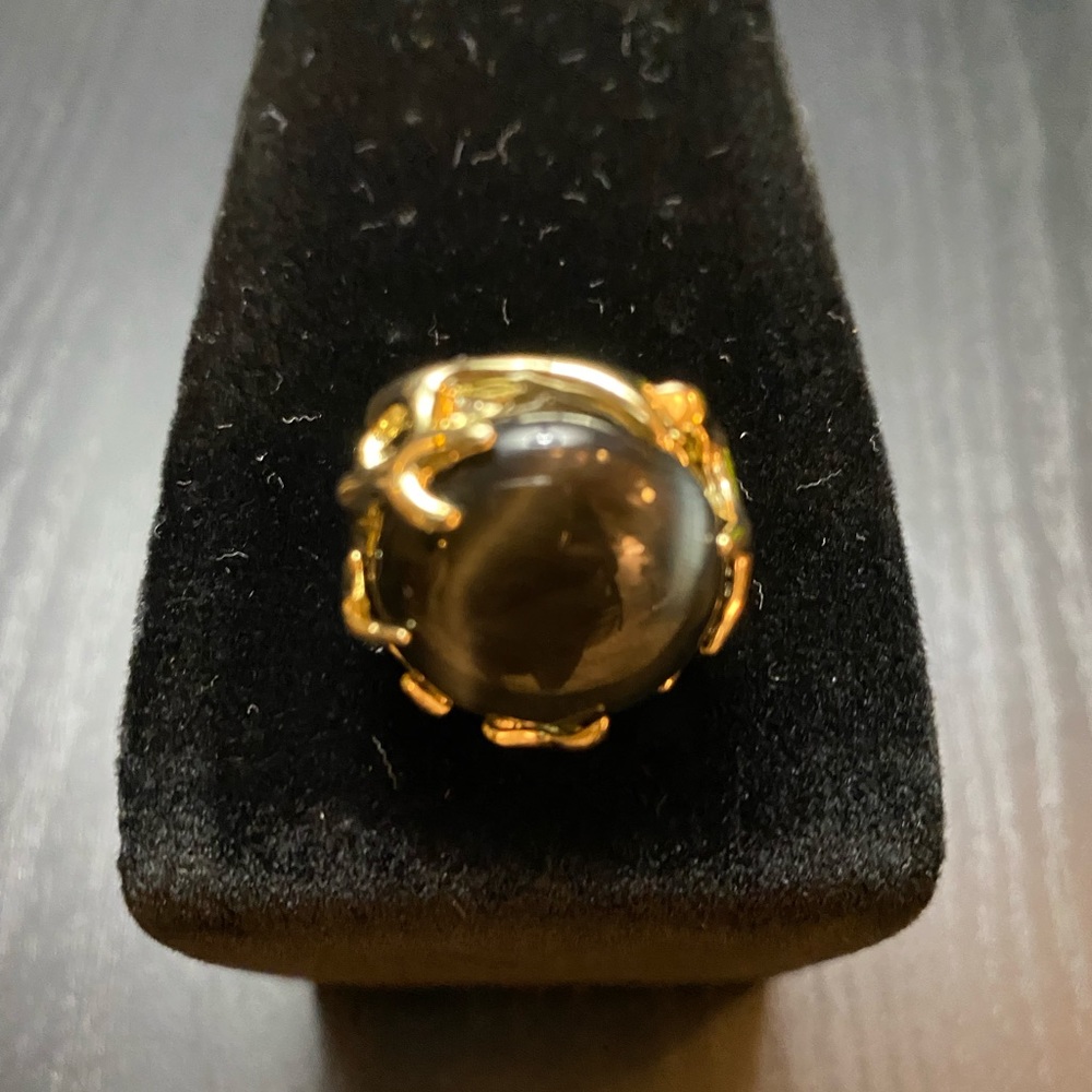 Kendra Scott black and gold ring.